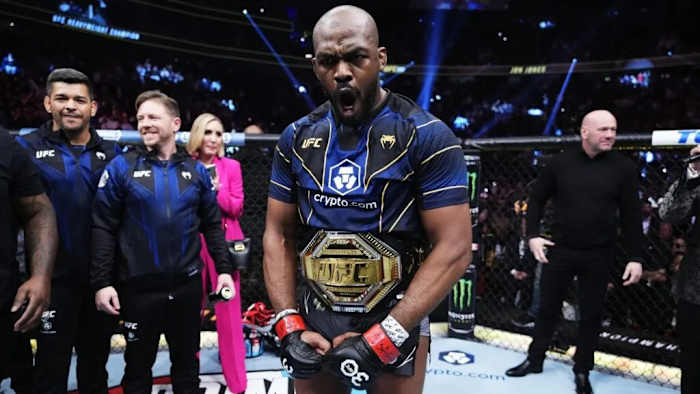 Jon Jones flexes after winning the UFC Heavyweight Championship inside T-Mobile Arena in Las Vegas, Nevada.